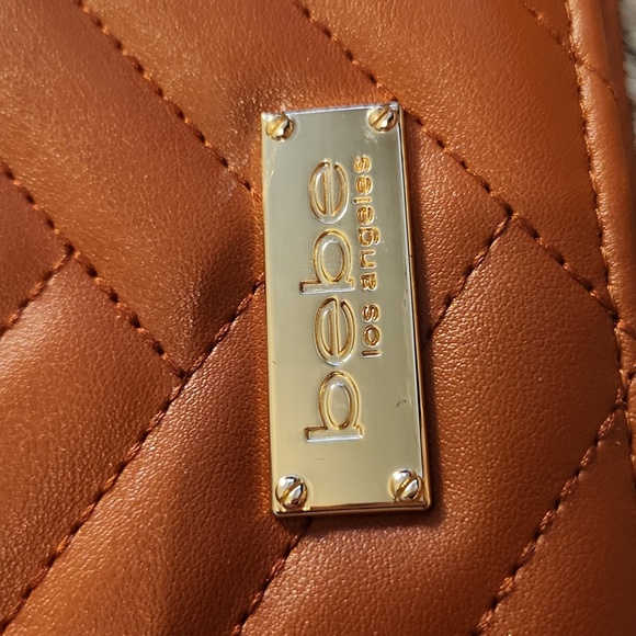 Bebe quilted bag with Gold rope chain cross body bag. Gently Used - Picture 4 of 16